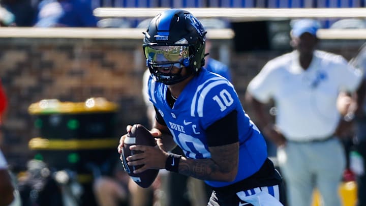 Oct 18, 2025; Durham, North Carolina, USA; Duke Blue Devils quarterback Darian Mensah (10) runs with the ball during the first half of the game against Georgia Tech Yellow Jackets at Wallace Wade Stadium. Mandatory Credit: Jaylynn Nash-Imagn Images Oct 18, 2025; Durham, North Carolina, USA; Duke Blue Devils quarterback Darian Mensah (10) runs with the ball during the first half of the game against Georgia Tech Yellow Jackets at Wallace Wade Stadium. Mandatory Credit: Jaylynn Nash-Imagn Images