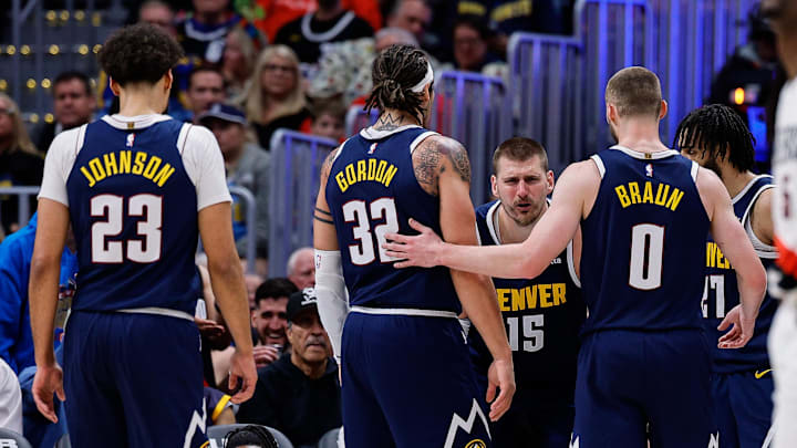 Apr 6, 2026; Denver, Colorado, USA; Denver Nuggets center Nikola Jokic (15) reacts after a play as forward Cam Johnson (23) and forward Aaron Gordon (32) and guard Christian Braun (0) and guard Jamal Murray (27) look on in the fourth quarter against the Portland Trail Blazers at Ball Arena. Mandatory Credit: Isaiah J. Downing-Imagn Images