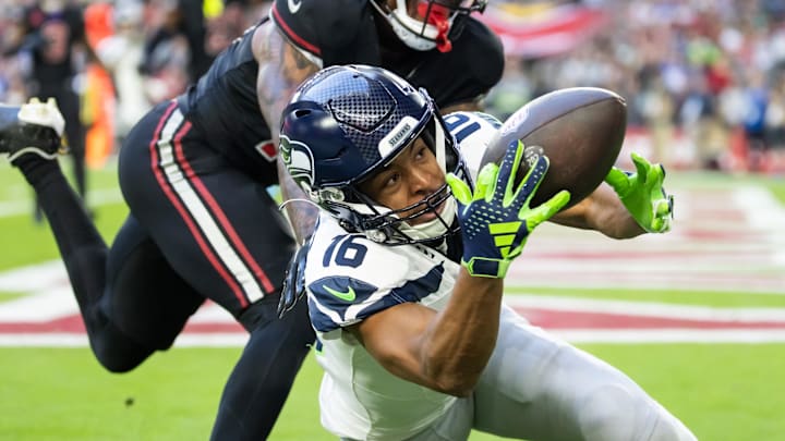 Dec 8, 2024; Glendale, Arizona, USA; Seattle Seahawks wide receiver Tyler Lockett (16) is unable to catch a pass in the end zone against Arizona Cardinals cornerback Max Melton in the second half at State Farm Stadium. Mandatory Credit: Mark J. Rebilas-Imagn Images