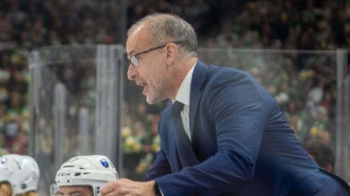 Jan 28, 2023; Saint Paul, Minnesota, USA; The Buffalo Sabres head coach Don Granato with referee Chris Lee (28) against the Minnesota Wild in the third period at Xcel Energy Center. Mandatory Credit: Matt Blewett-Imagn Images