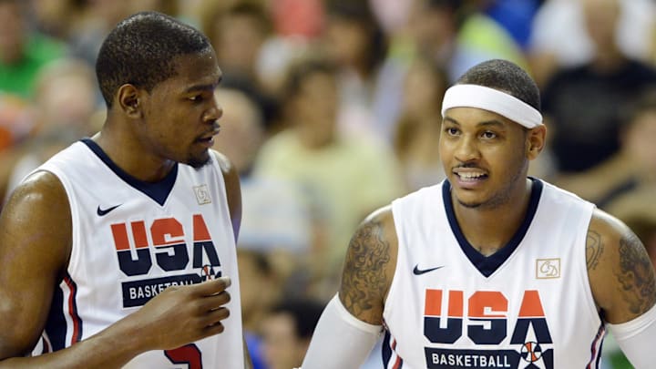 July 22, 2012; Barcelona, SPAIN; USA guard Kevin Durant (5) talks with teammate Carmelo Anthony (right) during the second half of an exhibition game against Argentina in preparation for the 2012 London Olympic Games at Palau Sant Jordi. 