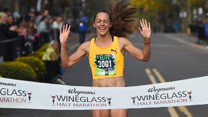 Jenny Simpson of Boulder, Colorado, finishes first in the Wegmans Wineglass Half Marathon women's race on Market Street in Corning on Oct. 6, 2024. Jenny Simpson of Boulder, Colorado, finishes first in the Wegmans Wineglass Half Marathon women's race on Market Street in Corning on Oct. 6, 2024.