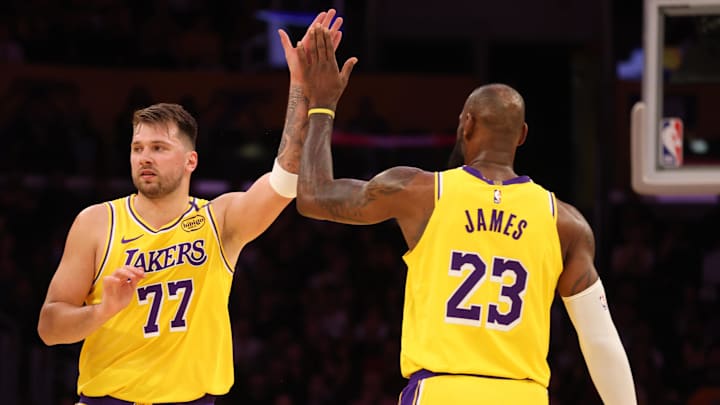 Feb 27, 2025; Los Angeles, California, USA; Los Angeles Lakers forward LeBron James (23) and guard Luka Doncic (77) react after a play during the first quarter against the Minnesota Timberwolves at Crypto.com Arena. Mandatory Credit: Jason Parkhurst-Imagn Images Feb 27, 2025; Los Angeles, California, USA; Los Angeles Lakers forward LeBron James (23) and guard Luka Doncic (77) react after a play during the first quarter against the Minnesota Timberwolves at Crypto.com Arena. Mandatory Credit: Jason Parkhurst-Imagn Images