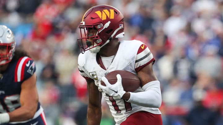 Nov 5, 2023; Foxborough, Massachusetts, USA; Washington Commanders receiver Terry McLaurin (17) runs the ball during the second half against the New England Patriots at Gillette Stadium. Mandatory Credit: Paul Rutherford-USA TODAY Sports