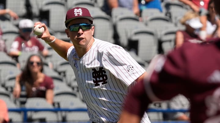 Mississippi State third baseman Ace Reese (3) fields a bunt by Texas A&M second baseman Ben Royo (10) but makes a wild throw to first in the first round of the SEC Baseball Tournament at the Hoover Met.