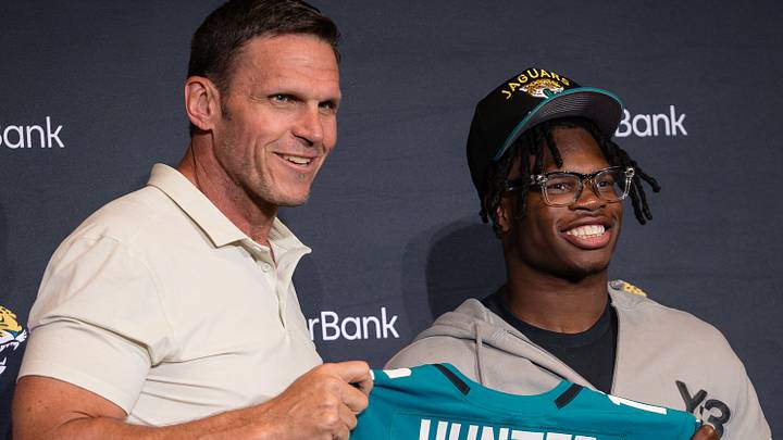 Apr 25, 2025; Jacksonville, FL, USA; Jacksonville Jaguars first round draft pick Travis Hunter poses for a photo with executive vice president of football operations Tony Boselli during a press conference at Miller Electric Center. Mandatory Credit: Travis Register-Imagn Images