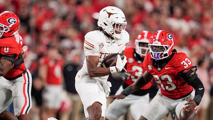 Texas Longhorns wide receiver Ryan Wingo (1) runs the ball against Georgia Bulldogs linebacker Quintavius Johnson (33) in the first half at Sanford Stadium. Texas Longhorns wide receiver Ryan Wingo (1) runs the ball against Georgia Bulldogs linebacker Quintavius Johnson (33) in the first half at Sanford Stadium.