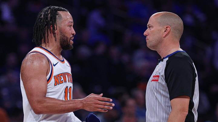 Knicks guard Jalen Brunson talks with a referee.