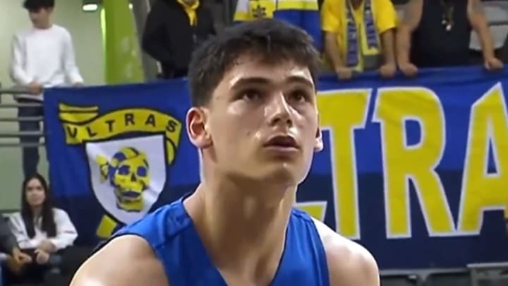 Purdue guard Omer Mayer shooting a free throw Purdue guard Omer Mayer shooting a free throw