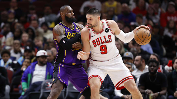 Dec 20, 2023; Chicago, Illinois, USA; Los Angeles Lakers forward LeBron James (23) defends against Chicago Bulls center Nikola Vucevic (9) during the second half at United Center. Mandatory Credit: Kamil Krzaczynski-Imagn Images Dec 20, 2023; Chicago, Illinois, USA; Los Angeles Lakers forward LeBron James (23) defends against Chicago Bulls center Nikola Vucevic (9) during the second half at United Center. Mandatory Credit: Kamil Krzaczynski-Imagn Images