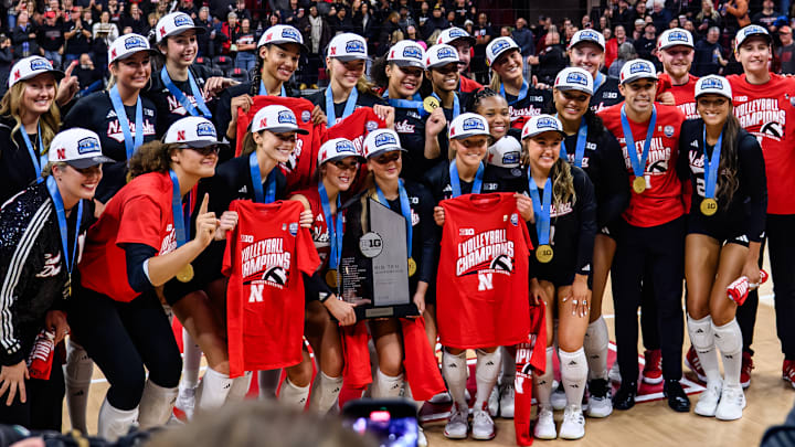 Nebraska players and staff celebrate their third straight Big Ten title in November after defeating Penn State. The league is adding a tournament at the end of the 2026 regular season. 