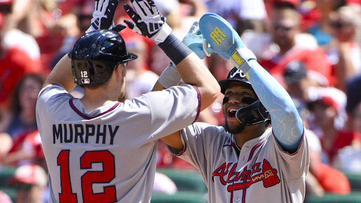 Jul 12, 2025; St. Louis, Missouri, USA;  Atlanta Braves catcher Sean Murphy (12) celebrates with right fielder Ronald Acuna Jr (13) after hitting a go ahead three run home run against the St. Louis Cardinals during the eighth inning at Busch Stadium. Mandatory Credit: Jeff Curry-Imagn Images