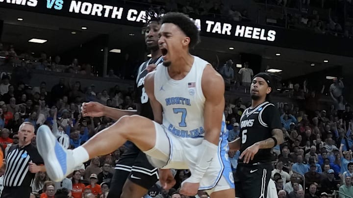 Mar 19, 2026; Greenville, SC, USA; North Carolina Tar Heels guard Seth Trimble (7) celebrates after dunking the ball past VCU Rams forward Michael Belle (8) in the first half of a first round game of the men's 2026 NCAA Tournament at Bon Secours Wellness Arena. Mandatory Credit: Jim Dedmon-Imagn Images