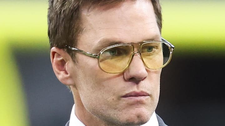 Nov 23, 2025; Arlington, Texas, USA; Former NFL quarterback Tom Brady looks on from the sideline before the game between the Philadelphia Eagles and Dallas Cowboys at AT&T Stadium. Mandatory Credit: Kevin Jairaj-Imagn Images