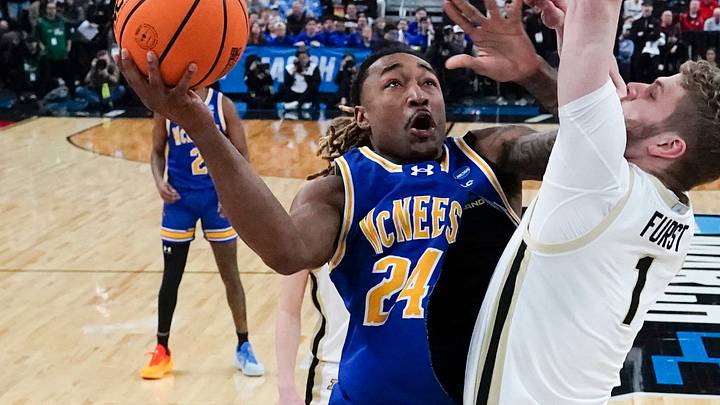 McNeese State Cowboys forward Christian Shumate (24) shoots a layup against Purdue Boilermakers forward Caleb Furst (1) during the first half at Amica Mutual Pavilion. Mandatory Credit: Gregory Fisher-Imagn Images McNeese State Cowboys forward Christian Shumate (24) shoots a layup against Purdue Boilermakers forward Caleb Furst (1) during the first half at Amica Mutual Pavilion. Mandatory Credit: Gregory Fisher-Imagn Images