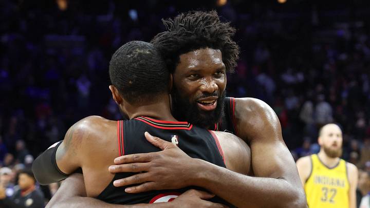 Philadelphia 76ers center Joel Embiid (21) hugs Paul George (8) after a victoryagainst the Indiana Pacers during at Xfinity Mobile Arena. 