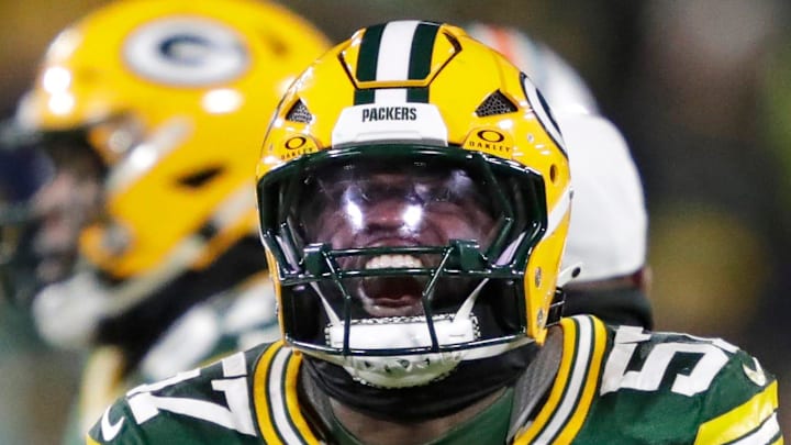 Green Bay Packers defensive end Brenton Cox Jr. (57) celebrates sacking Miami Dolphins quarterback Tua Tagovailoa in 2024.