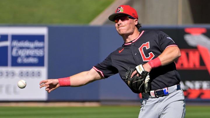Feb 21, 2026; Phoenix, Arizona, USA;  Cleveland Guardians second baseman Travis Bazzana (72) makes a play  in the fourth inning against the Milwaukee Brewers at American Family Fields of Phoenix. Mandatory Credit: Jayne Kamin-Oncea-Imagn Images