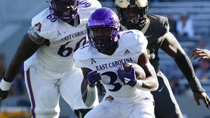 Oct 19, 2024; West Point, New York, USA; East Carolina Pirates running back London Montgomery (34) carries during the second half against the Army Black Knights at Michie Stadium. Mandatory Credit: Lucas Boland-Imagn Images