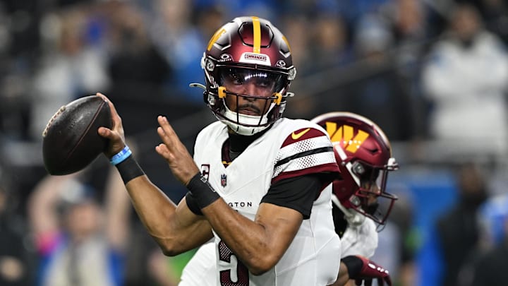 Washington Commanders quarterback Jayden Daniels (5) throws a pass during the first quarter against Detroit Lions in a 2025 NFC divisional round game at Ford Field. Mandatory Credit: Lon Horwedel-Imagn Images
