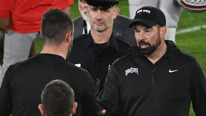 Jan 1, 2025; Pasadena, CA, USA; Ohio State Buckeyes head coach Ryan Day (right) shakes hands with Oregon Ducks head coach Dan Lanning at the conclusion of the Rose Bowl game at Rose Bowl Stadium. Mandatory Credit: Robert Hanashiro-Imagn Images Jan 1, 2025; Pasadena, CA, USA; Ohio State Buckeyes head coach Ryan Day (right) shakes hands with Oregon Ducks head coach Dan Lanning at the conclusion of the Rose Bowl game at Rose Bowl Stadium. Mandatory Credit: Robert Hanashiro-Imagn Images