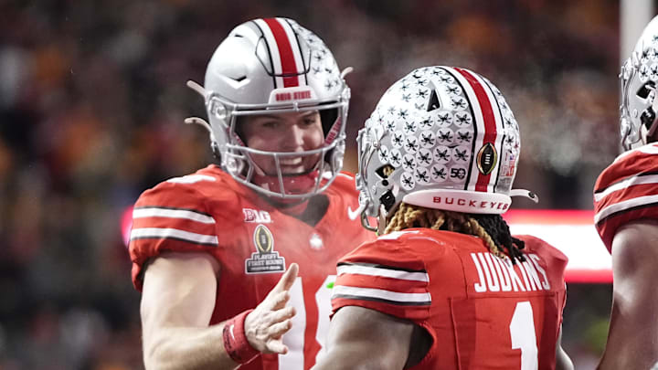 Dec 21, 2024; Columbus, Ohio, USA; Ohio State Buckeyes running back Quinshon Judkins (1) celebrates with quarterback Will Howard (18) after a touchdown against the Tennessee Volunteers during the first half of a College Football Playoff first round game at Ohio Stadium. Mandatory Credit: Adam Cairns-Imagn Images Dec 21, 2024; Columbus, Ohio, USA; Ohio State Buckeyes running back Quinshon Judkins (1) celebrates with quarterback Will Howard (18) after a touchdown against the Tennessee Volunteers during the first half of a College Football Playoff first round game at Ohio Stadium. Mandatory Credit: Adam Cairns-Imagn Images