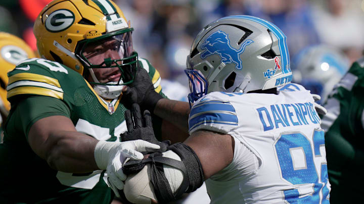 Green Bay Packers offensive tackle Zach Tom (50) blocks Detroit Lions defensive tackle Marcus Davenport (92) Green Bay Packers offensive tackle Zach Tom (50) blocks Detroit Lions defensive tackle Marcus Davenport (92)