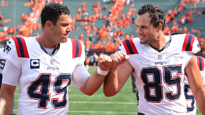 Sep 8, 2024; Cincinnati, Ohio, USA; New England Patriots tight end Hunter Henry (85) and long snapper Joe Cardona (49) celebrate following the win over the Cincinnati Bengals at Paycor Stadium. Mandatory Credit: Joseph Maiorana-Imagn Images