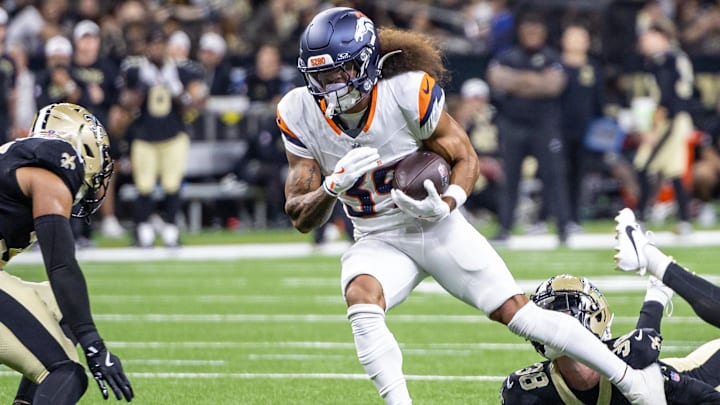 Aug 23, 2025; New Orleans, Louisiana, USA; Denver Broncos wide receiver Kyrese Rowan (39) is tackled by New Orleans Saints safety Elliott Davison (35) during the second half at Caesars Superdome. 