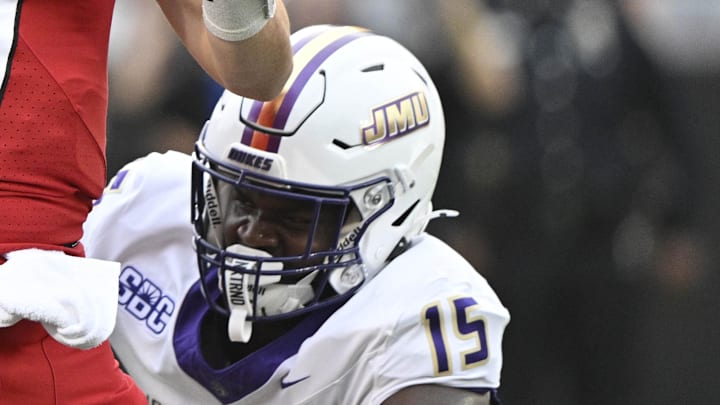 Sep 5, 2025; Louisville, Kentucky, USA; Louisville Cardinals quarterback Miller Moss (7) looks to pass under the pressure of James Madison Dukes defensive end Sahir West (15) during the first quarter at L&N Federal Credit Union Stadium. Mandatory Credit: Jamie Rhodes-Imagn Images Sep 5, 2025; Louisville, Kentucky, USA; Louisville Cardinals quarterback Miller Moss (7) looks to pass under the pressure of James Madison Dukes defensive end Sahir West (15) during the first quarter at L&N Federal Credit Union Stadium. Mandatory Credit: Jamie Rhodes-Imagn Images