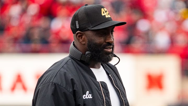 Nov 2, 2024; Lincoln, Nebraska, USA; UCLA Bruins head coach DeShaun Foster walks off after a timeout in the second quarter against the Nebraska Cornhuskers at Memorial Stadium. Mandatory Credit: Dylan Widger-Imagn Images