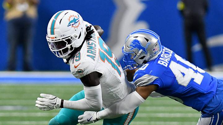 Aug 16, 2025; Detroit, Michigan, USA; Miami Dolphins wide receiver Andrew Armstrong (19) gets tackled by Detroit Lions cornerback Luq Barcoo (40) in the fourth quarter at Ford Field. Mandatory Credit: Eamon Horwedel-Imagn Images