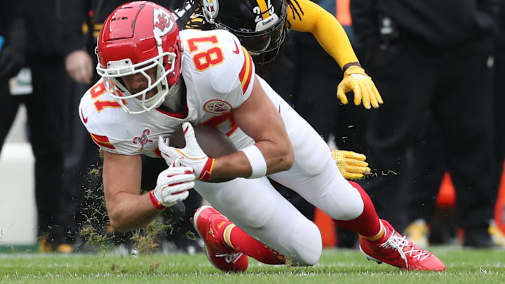 Dec 25, 2024; Pittsburgh, Pennsylvania, USA; Kansas City Chiefs tight end Travis Kelce (87) makes a catch against Pittsburgh Steelers cornerback Donte Jackson (26) during the first quarter at Acrisure Stadium. Dec 25, 2024; Pittsburgh, Pennsylvania, USA; Kansas City Chiefs tight end Travis Kelce (87) makes a catch against Pittsburgh Steelers cornerback Donte Jackson (26) during the first quarter at Acrisure Stadium.