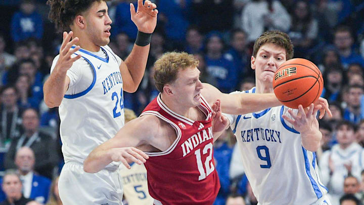 Kentucky Wildcats forward Trent Noah (9) pressures Indiana Hoosiers forward Tucker DeVries (12) with Kentucky Wildcats center Malachi Moreno (24) in the first half. Kentucky beat the Hoosiers 72-60 during college basketball at Rupp Arena in Lexington, Kentucky December 13, 2025. Devries finished with 15 points. Kentucky Wildcats forward Trent Noah (9) pressures Indiana Hoosiers forward Tucker DeVries (12) with Kentucky Wildcats center Malachi Moreno (24) in the first half. Kentucky beat the Hoosiers 72-60 during college basketball at Rupp Arena in Lexington, Kentucky December 13, 2025. Devries finished with 15 points.