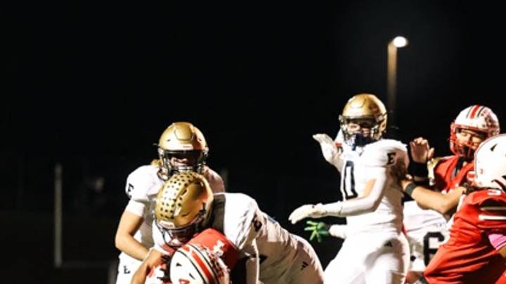 Elizabethtown High School linebacker Darian Bryant tackles John Hardin High School running back Cavalli Pittman Friday, Oct. 24, 2025. 