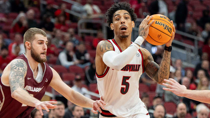 Louisville Cardinals guard Terrence Edwards Jr. (5) makes his way to the basket around Bellarmine Knights defenders during their game on Tuesday, Nov. 19, 2024 at the KFC Yum! Center in Louisville, Ky.