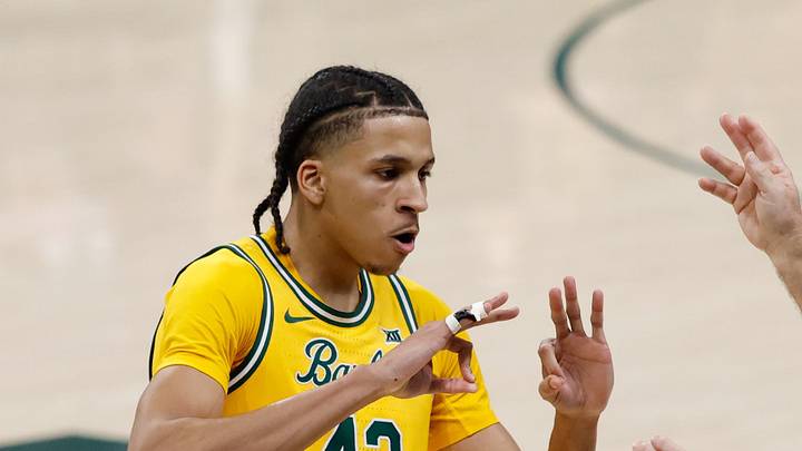 Baylor Bears guard Cameron Carr (43) reacts after scoring a three-point basket against the Utah Utes Baylor Bears guard Cameron Carr (43) reacts after scoring a three-point basket against the Utah Utes