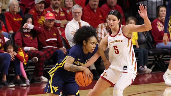 Jan 11, 2026; Ames, Iowa, USA; Iowa State Cyclones guard Evangelia Paulk (5) defends West Virginia Mountaineers guard Sydney Shaw (5) during the second half at James H. Hilton Coliseum. Mandatory Credit: Reese Strickland-Imagn Images Jan 11, 2026; Ames, Iowa, USA; Iowa State Cyclones guard Evangelia Paulk (5) defends West Virginia Mountaineers guard Sydney Shaw (5) during the second half at James H. Hilton Coliseum. Mandatory Credit: Reese Strickland-Imagn Images