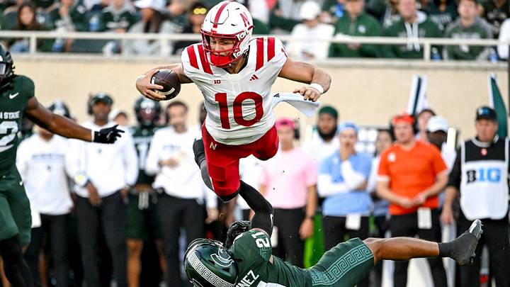 Anthony Colandrea launches into the air as Michigan State’s Nikai Martinez makes a tackle. Anthony Colandrea launches into the air as Michigan State’s Nikai Martinez makes a tackle.