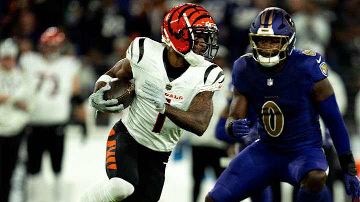 Cincinnati Bengals wide receiver Ja'Marr Chase (1) runs after a catch as Baltimore Ravens inside linebacker Roquan Smith (0) defends in the first quarter of the NFL game at M&T Banks Stadium in Baltimore on Thursday, Nov. 7, 2024.