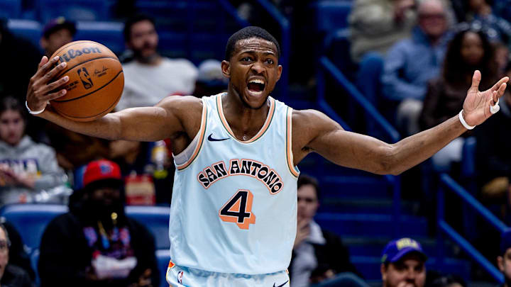 Feb 23, 2025; New Orleans, Louisiana, USA;  San Antonio Spurs guard De'Aaron Fox (4) reacts  to a play against the New Orleans Pelicans during the second half at Smoothie King Center. Mandatory Credit: Stephen Lew-Imagn Images