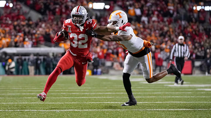 Ohio State Buckeyes running back TreVeyon Henderson runs for a touchdown against the Tennessee Volunteers.