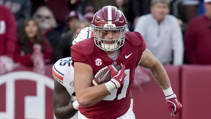 Nov 30, 2024; Tuscaloosa, Alabama, USA;  Alabama Crimson Tide tight end CJ Dippre (81) runs after a catch against Auburn Tigers buck Jalen McLeod (35) during the first half at Bryant-Denny Stadium. Mandatory Credit: Gary Cosby Jr.-Imagn Images