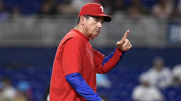 Jun 17, 2025; Miami, Florida, USA;  Philadelphia Phillies manager Rob Thomson signals for pitcher Tanner Banks during the 6th inning against the Miami Marlins at loanDepot Park. Mandatory Credit: Michael Laughlin-Imagn Images