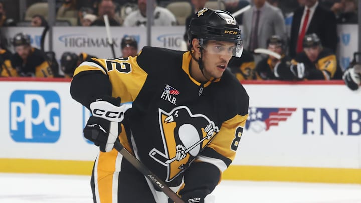 Oct 21, 2025; Pittsburgh, Pennsylvania, USA; Pittsburgh Penguins defenseman Caleb Jones (82) handles the puck against the Vancouver Canucks during the third period at PPG Paints Arena. Mandatory Credit: Charles LeClaire-Imagn Images Oct 21, 2025; Pittsburgh, Pennsylvania, USA; Pittsburgh Penguins defenseman Caleb Jones (82) handles the puck against the Vancouver Canucks during the third period at PPG Paints Arena. Mandatory Credit: Charles LeClaire-Imagn Images