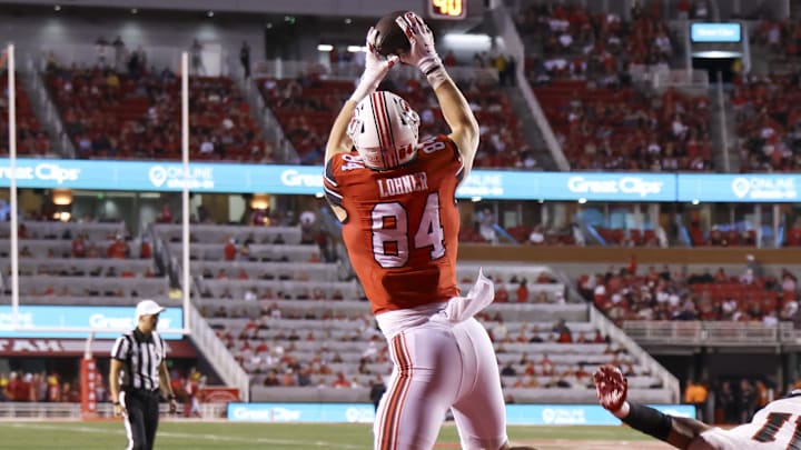 Aug 29, 2024; Salt Lake City, Utah, USA; Utah Utes tight end Caleb Lohner (84) jumps for a pass against Southern Utah Thunderbirds safety Brendan Hale (11) during the third quarter at Rice-Eccles Stadium. 