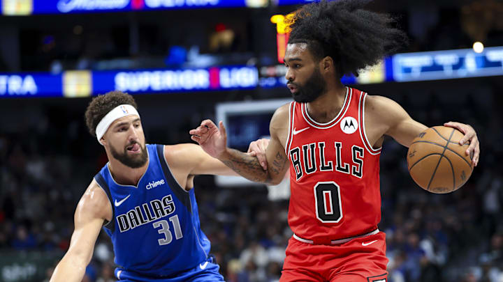 Nov 6, 2024; Dallas, Texas, USA;  Chicago Bulls guard Coby White (0) controls the ball as Dallas Mavericks guard Klay Thompson (31) defends during the first quarter at American Airlines Center. Mandatory Credit: Kevin Jairaj-Imagn Images