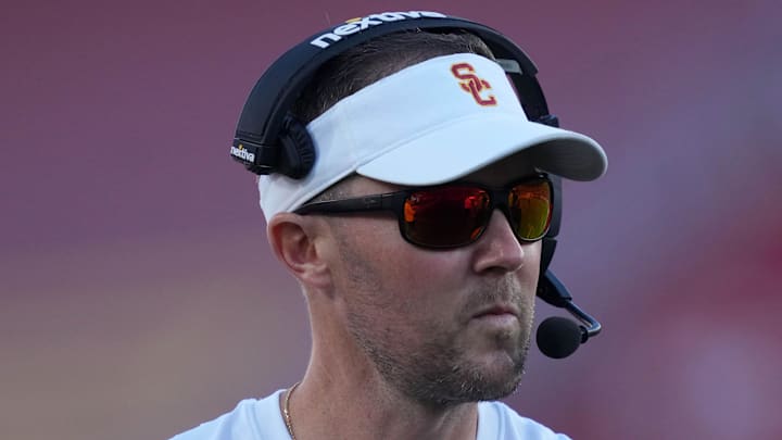 Oct 21, 2023; Los Angeles, California, USA; Southern California Trojans head coach Lincoln Riley watches from the sidelines against the Utah Utes in the first half at United Airlines Field at Los Angeles Memorial Coliseum. Mandatory Credit: Kirby Lee-Imagn Images Oct 21, 2023; Los Angeles, California, USA; Southern California Trojans head coach Lincoln Riley watches from the sidelines against the Utah Utes in the first half at United Airlines Field at Los Angeles Memorial Coliseum. Mandatory Credit: Kirby Lee-Imagn Images