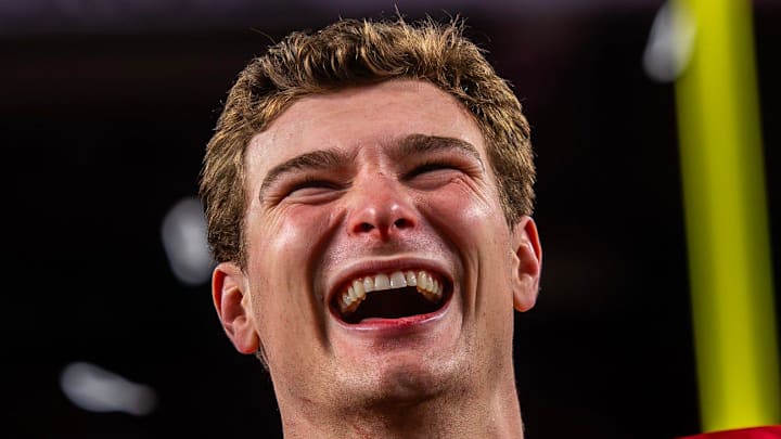 Indiana's Fernando Mendoza (15) smiles on the podium after the College Football Playoff National Championship college football game at Hard Rock Stadium in Miami Gardens on Monday, Jan. 19, 2026.
