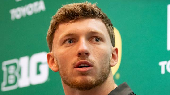 Oregon defensive back Dillon Thieneman speaks with reporters.